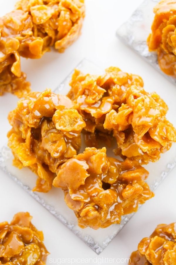 overhead image of a three cornflake cookies on a coaster
