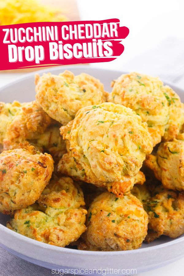 A delicious twist on classic drop biscuits, these Zucchini Cheddar Drop Biscuits are tender, light and fluffy with a buttery, cheesy flavor that will pair perfectly with almost any dinner!