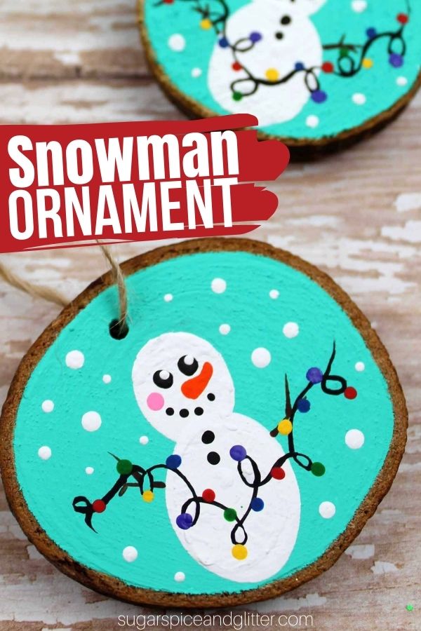 A fun snowman craft to make with kids, these Snowman Wood Slice Ornaments add some Christmas cheer and whimsy to your Christmas decor. Kids can paint the snowmen decorating with lights, or create different whimsical scenes with their snowmen. You can also use fingerprints for the snowman's body or the lights.