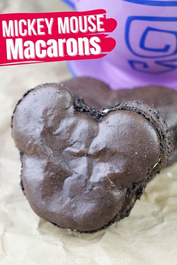 A Disney-inspired cookies and cream flavored macaron with dark chocolate cookies sandwiched with a vanilla buttercream frosting. These decadent Disney macarons are a fun treat for the Disney-obsessed foodie.