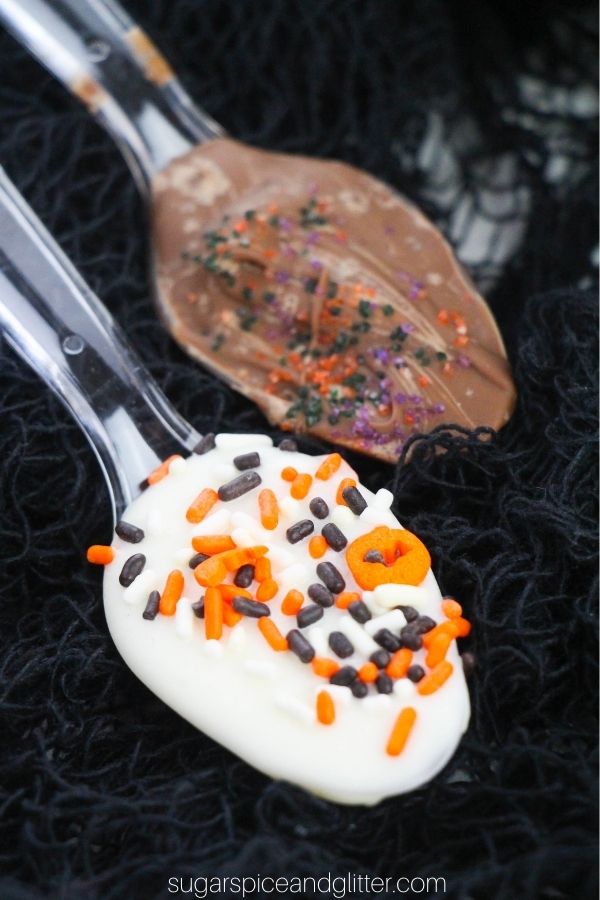 close-up of Halloween chocolate spoons on a black web fabric