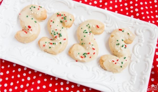 Italian S-Cookies on a white platter set on a red polka dot napkin