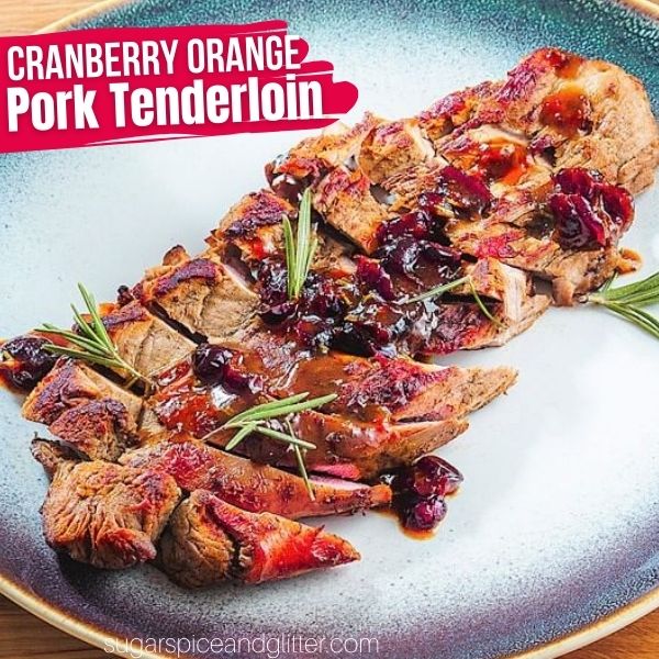 cranberry orange pork tenderloin on a blue platter