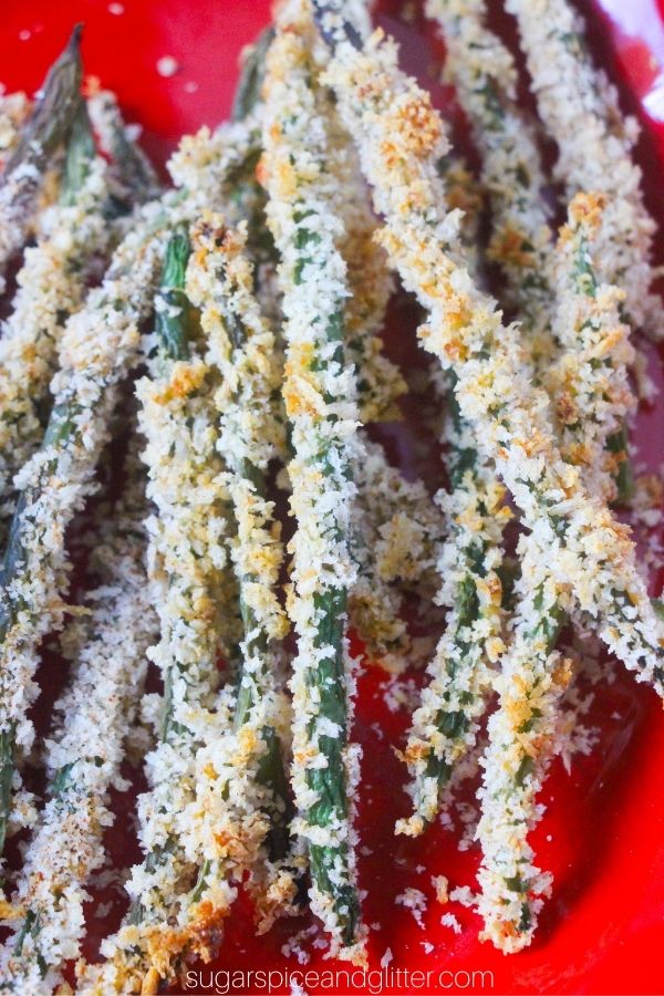 close-up image of green bean fries on a red plate