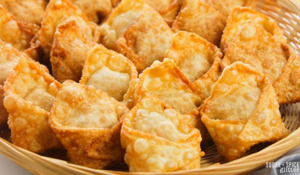 close-up picture of a wicker basket filled with jalapeno popper wontons