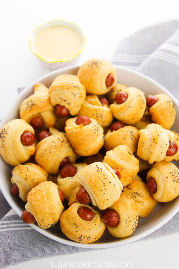bowl full of piggies in a blanket with a gray napkin