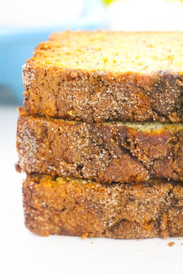 a stack of snickerdoodle banana bread slices with the crackly cinnamon sugar topping facing the camera