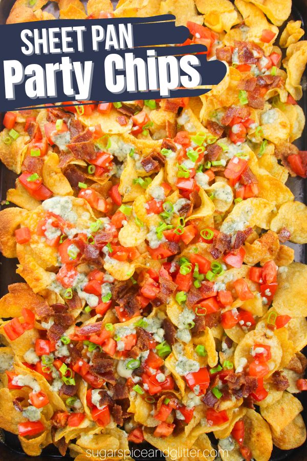 How to make Blue Cheese Sheet Pan Party Chips, an addictive appetizer everyone is going to love with salty kettle chips, blue cheese crumble, bacon, tomtaoes and green onions.
