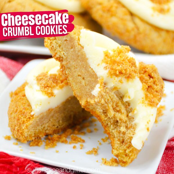 a thick cheesecake cookie broken in half on a white square plate set on a red plaid napkin