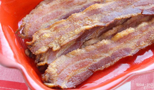 baked bacon in a red casserole dish