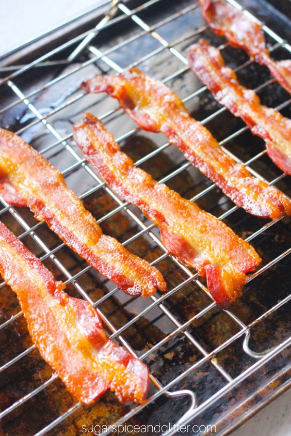 baked bacon on a rack set on a cookie sheet