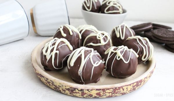 OREO Cookie balls on a rustic plate with OREOs in the background