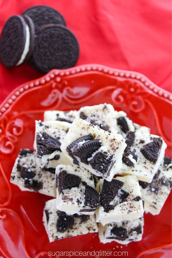 overhead image of a pile of OREO fudge on a red plate with OREO cookies on the side