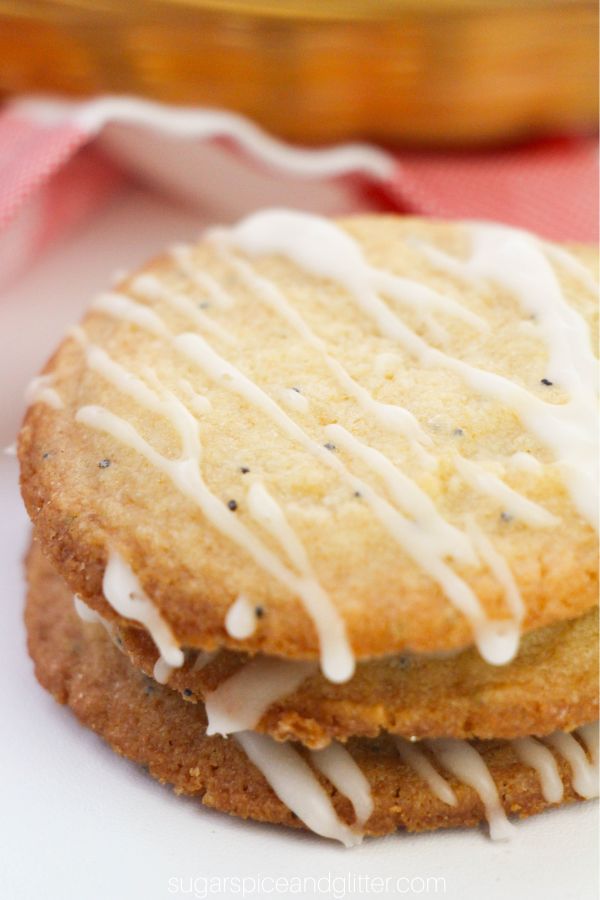close-up image of stack of glazed lemon poppyseed cookies