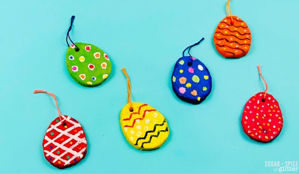 overhead image of 6 finished and painted salt dough Easter egg ornaments